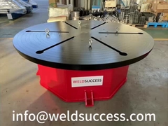 Tabel berputar horizontal dengan sudut rotasi yang telah ditetapkan sebelumnya melalui kontrol PLC dan layar sentuh.